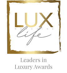 Logo for Lux Life Leaders in Luxury Awards with gold and white design.